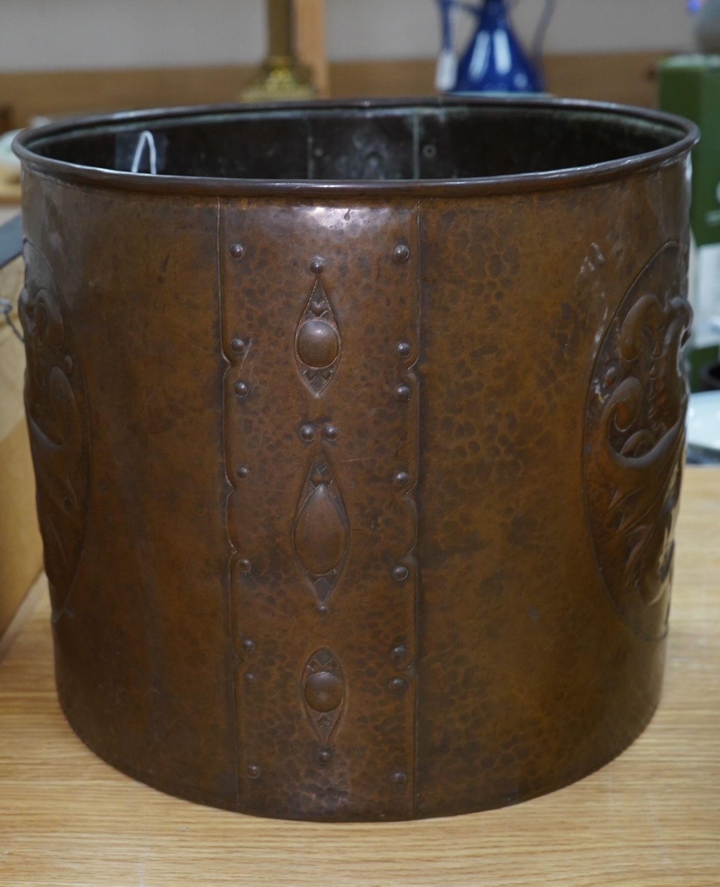 A large Arts and Crafts embossed copper jardiniere decorated with seahorses, stamped Newlyn to base, 28cm high, 33cm in diameter. Condition - good